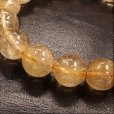 画像5: 透明感がハンパない  13ミリ  お試し価格  現品一点物  ゴールドルチル  ブレス   金針水晶  57g  R98  天然石  最強金運  数珠  開運招来  パワーストーン  ルチル  開運  1点物  目玉  ギフト  贈り物    誕生日  / 誕プレ 魔除け 運気向上 お揃い クリスマスプレゼント お祝  高品質 / 京海堂 (5)