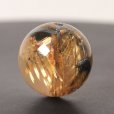 画像1: 目が離せない一粒！ 約14ミリ 太陽放射ルチルクォーツ【GHTU17 5g】 一点物 1粒売り ハンドメイド 交換用ゴム付＆巾着1枚 【金運アップ・目標達成・家族円満・自己肯定感】 金針水晶 お守り効果 ご褒美 お揃い ギフト 京海堂 (1)